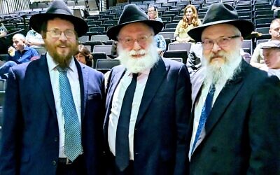 Keynote speaker Rabbi Simon Jacobson, center, joins Rabbis Yisroel Altein and Yisroel Rosenfeld. Photo by Alexander Small