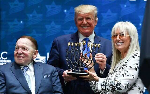 Miriam Adelson poses with her husband Sheldon Adleson and Donald Trump at the Israeli American Council National Summit 2019 in Hollywood, Florida, Dec. 7, 2019. (Mandel NGAN/AFP via Getty Images)