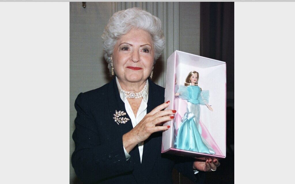 Ruth Handler holds a Barbie that was created for the doll's 40th anniversary party in New York City, Feb. 7, 1999. (Jeff Christensen/Getty Images)