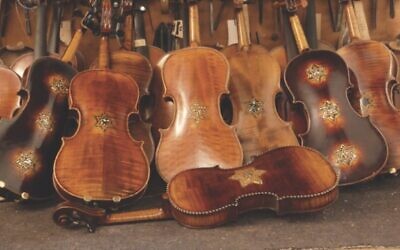 The Violins of Hope, a rare collection of restored violins from the Holocaust, will be displayed and played at venues throughout Greater Pittsburgh this fall. (Photo courtesy of Violins of Hope Greater Pittsburgh)
