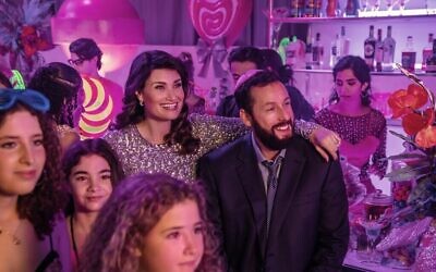 Idina Menzel and Adam Sandler in a scene from the Netflix film 'You Are So Not Invited to My Bat Mitzvah.' (Scott Yamano/Netflix, via The Times of Israel)