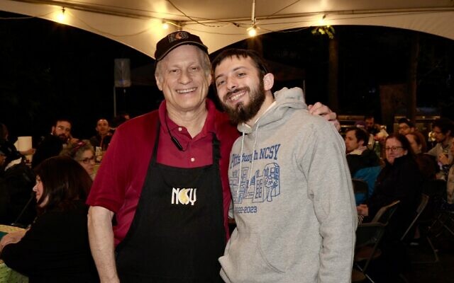 Rabbi Meir Tabak (right) and Dan Butler at the 2023 NCSY Garden Sizzler. (Photo by Sandy Riemer)