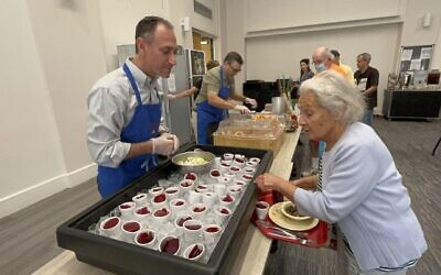 Jewish Community Center of Greater Pittsburgh President and CEO Jason Kunzman volunteers at an AgeWell J Cafe lunch. (Photo courtesy of Jewish Community Center of Greater Pittsburgh)