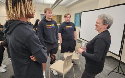 Carol Black, right, speaks with Canon-McMillan students during a day-long program at Frank Sarris Public Library in Canonsburg. Photo by Adam Reinherz