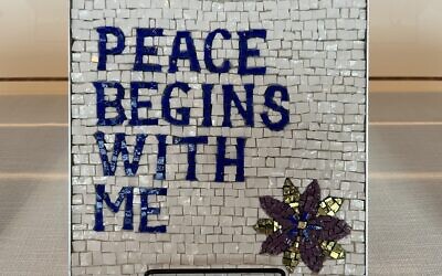 Titled "Mantra," this is one of the mosaics in a traveling exhibit that was part of the Eradicate Hate Global Summit in Pittsburgh. Artist Carol Nemir of Austin, Texas, writes in part that "I believe that whether we realize it or not, none of us has been left untouched by the hate crimes and mass shootings that pervade today's society. The acts have hit closer to home to some than others, but we all have been impacted in some way, and we each contribute in some way to the direction in which the web will next ripple. The mantra 'Peace Begins With Me' reminds me of the responsibility and the power I have to ensure that the choices I make on a daily basis contribute to a more peaceful world." (Bob Batz Jr./Pittsburgh Union Progress)