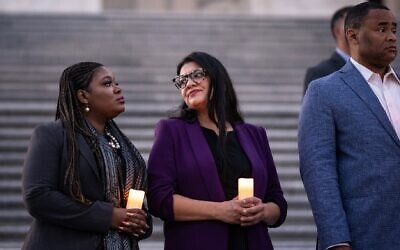 Reps. Cori Bush, a Missouri Democrat, and Rashida Tlaib, a Michigan Democrat, talk with each other as they attend a bipartisan candlelight vigil with members of Congress to commemorate one month since the Hamas terrorist attacks in Israel on Oct. 7, at the U.S. Capitol, Nov. 7, 2023 (Drew Angerer/Getty Images)