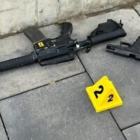 A handout photo of a rifle and pistol found at the scene of a shooting terror attack in Jerusalem, Nov. 30, 2023. (Israel Police)