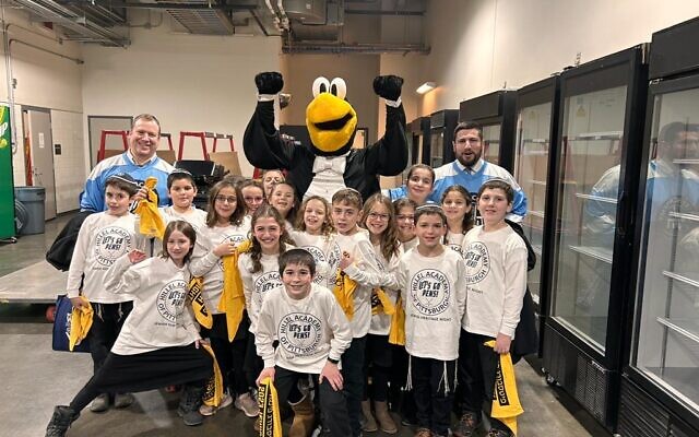 Hillel Academy of Pittsburgh students sang the National Anthem before the Pittsburgh Penguins defeated the Carolina Hurricanes during Jewish Heritage Night and PPG Paints Arena. (Photo provided by Rabbi Oren Levy)