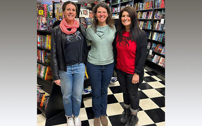 Kristy Bodnar (left), co-owner of Mystery Lovers Bookshop stands with Holocaust Center of Pittsburgh’s Emily Loeb and Tara Goldberg-DeLeo, co-owner (right). The independent bookshop recently donated over $1,000 to the Holocaust Center of Pittsburgh. (Photo provided by Tara Goldberg-DeLeo)