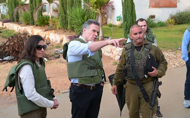 U.S. Senate candidate David McCormick (pointing) and wife Dina Powell McCormick visit Kfar Azza, one of the sites of Hamas’s Oct. 7 massacre, in early January 2023. (Courtesy photo via JNS)