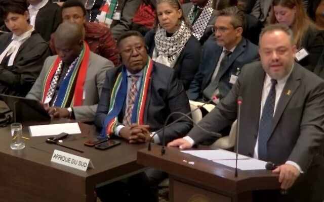The Israeli Foreign Ministry's legal adviser Tal Becker speaks at The Hague on Jan. 12, 2024, as members of the South African delegation look on (Screenshot via The Times of Israel)