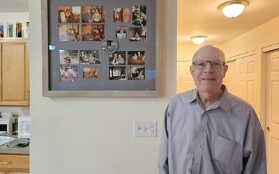 John Neiman stands next to photos of his friend Otto Frank. (Photo by David Rullo)