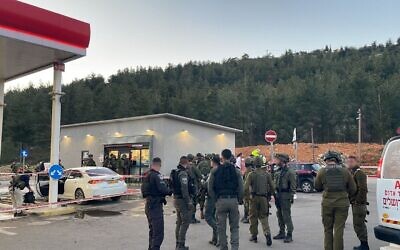 Israeli army troops consult after a terrorist attack at a gas station adjacent to the West Bank settlement of Eli, Feb. 29, 2024. (IDF)