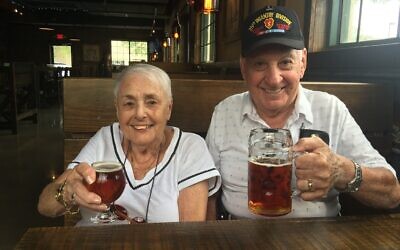 Kurt and Edith Leuchter raise a glass at a Florida brewery. Their daughter, Deborah, is now telling their survival story in local breweries around Pittsburgh. (Photo provided by Deborah Stueber)