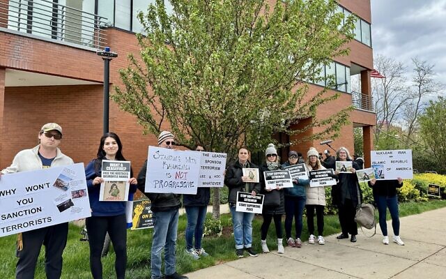 Several community members stood in protest outside the Pittsburgh Federation of Teachers building on April 21 (Photo by Julie Paris)