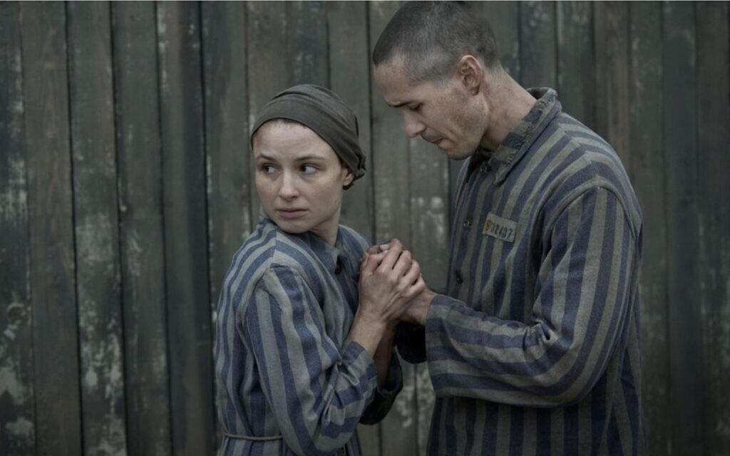 Jonah Hauer-King as Lali Sokolov and Anna Próchniak as Gita Furman embrace in Auschwitz in the first episode of Peacock's "The Tattooist of Auschwitz." (Martin Mlaka/Sky UK via JTA) Jonah Hauer-King as Lali Sokolov and Anna Próchniak as Gita Furman embrace in Auschwitz in the first episode of Peacock's "The Tattooist of Auschwitz." (Martin Mlaka/Sky UK via JTA)