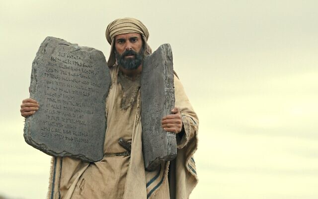 Avi Azulay as Moses holds the Ten Commandments in the Netflix series “Testament: The Story of Moses,”. (Courtesy Netflix via JTA)