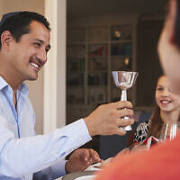 Raise a glass to intergenerational conversation this Pesach. (Photo by monkeybusinessimages via iStock)