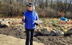 Lauren Mallinger stands near the Kavod Garden. (Photo by Adam Reinherz)