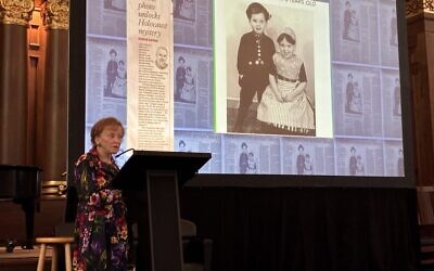 Marion Ein Lewin shares her memories as a Holocaust survivor, with a childhood photo of her and her twin brother, dressed in traditional clothing by their nanny Marretje, as well as a clipping of a column by Steve Lopez (Photo by Abigail Hakas)