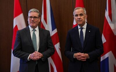 Britain's Prime Minister Keir Starmer (left) and Canada's Prime Minister Mark Carney pose before the start of the G7 summit, on Parliament Hill in Ottawa, June 15, 2025. (Photo by Suzanne Plunkett/WPA Pool/Getty Images, via JNS)