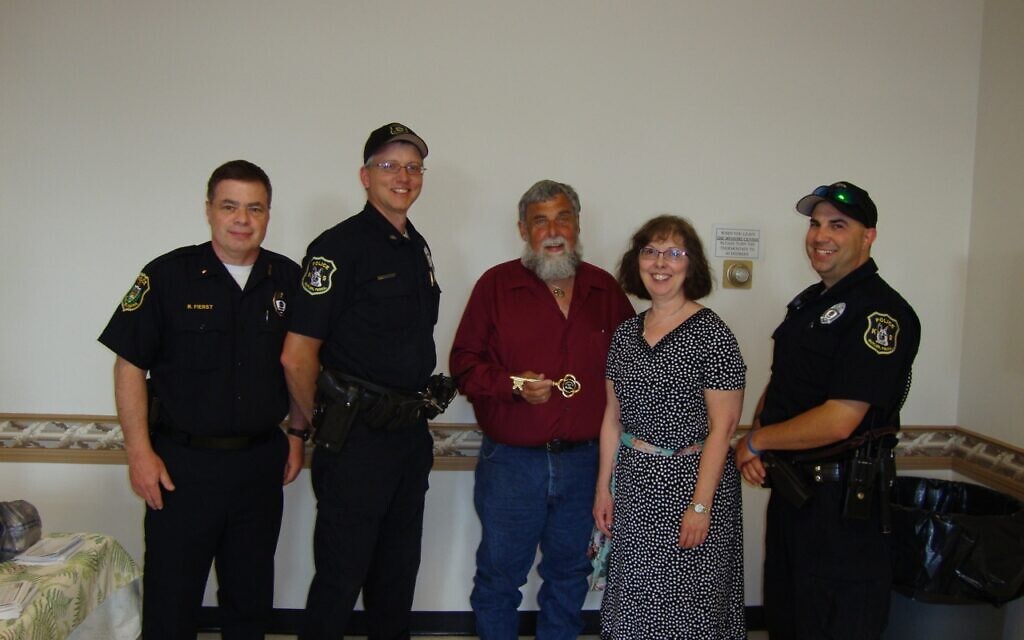 Mayor Maggie Stock presented Denny Offstein the key to the City of Butler, May 22, 2013, with Butler city police officers (Photo courtesy of Denny Offstein)
