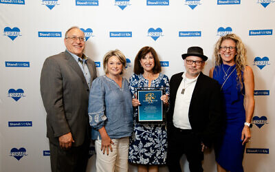 Julie Paris , SWU Mid-Atlanitc regional director (right) with the Chronicle staff, from left: Jim Busis, Amy Weiss, Toby Tabachnick and David Rullo (Adam Reinherz not pictured) (Photo by Christina Montemurro Photography)