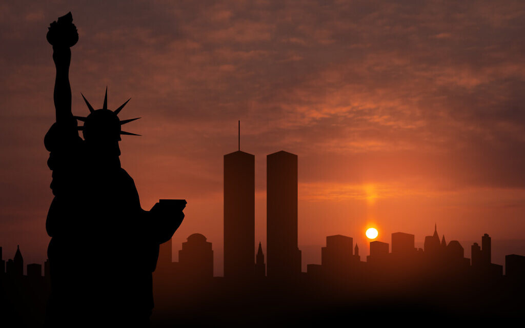 New York skyline silhouette with Twin Towers and The Statue of Liberty at sunset. 09.11.2001 American Patriot Day banner (Photo by vadimrysev via iStock)