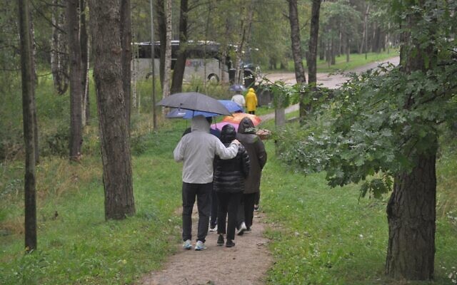 Classrooms Without Borders seminar participants exit the Rumbula forest in Riga, Latvia. (Photo by Adam Reinherz)