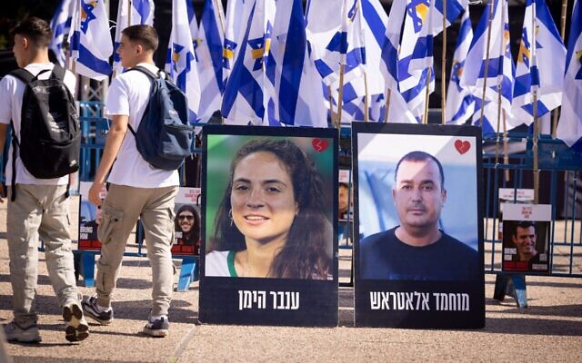 Posters of deceased hostages Inbar Hayman and Muhammad Al-Atarash stand in Hostage Squares in Tel Aviv after their release, Oct. 16, 2025. (Miriam Alster/Flash90) Posters of deceased hostages Inbar Hayman and Muhammad Al-Atarash stand in Hostage Squares in Tel Aviv after their release, Oct. 16, 2025. (Miriam Alster/Flash90)