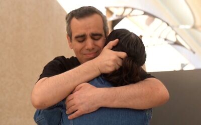 Released hostage Omri Miran reunites with his wife Lishay Miran-Lavi after over two years in Hamas captivity, at the Re’im base on October 13, 2025 (Israel Defense Forces)