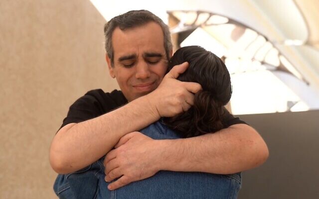 Released hostage Omri Miran reunites with his wife Lishay Miran-Lavi after over two years in Hamas captivity, at the Re’im base on October 13, 2025 (Israel Defense Forces)