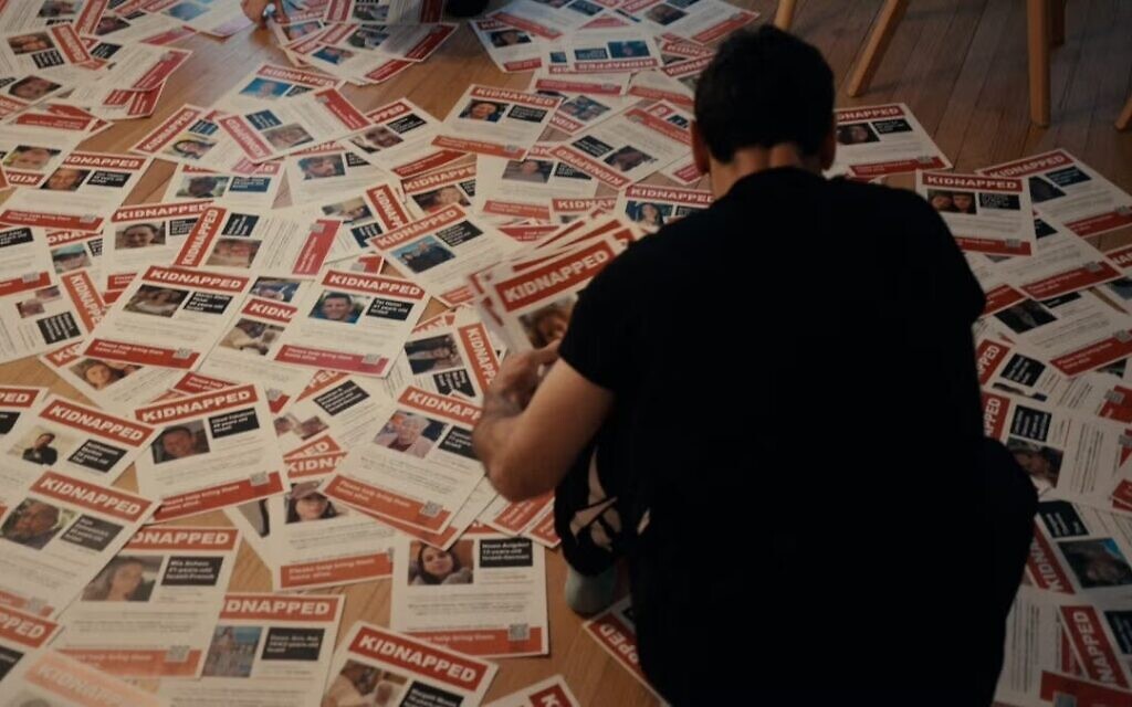 The documentary "Torn" (2024) examines the poster wars in New York City, when activists put up and ripped down signs calling attention to Israeli hostages in Gaza. (Courtesy Nim Shapira)