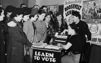 Women surrounded by posters in English and Yiddish supporting Franklin D. Roosevelt, Herbert H. Lehman, and the American Labor Party teach other women how to vote, 1935. (Photo courtesy of Kheel Center, Cornell University Library via Flickr)