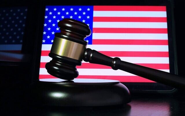 A gavel in front of a screen displaying the U.S. flag. (Credit: Sergei Tokmakov/Pixabay) A gavel in front of a screen displaying the U.S. flag. (Credit: Sergei Tokmakov/Pixabay)