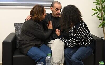 Released hostage Eli Sharabi reunites with his mother Chana and sister Osnat at an army facility near the Gaza border after 491 days in Hamas captivity, Feb. 8, 2025. His wife and two daughters were murdered by Hamas terrorists on Oct.  7, 2023. (Photo courtesy of the IDF)
