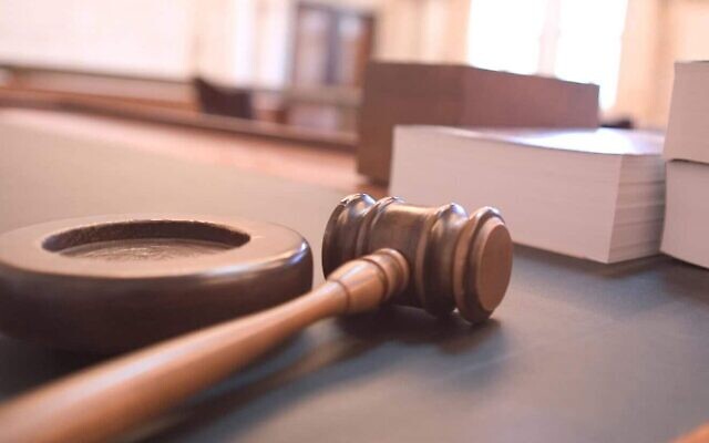Gavel on a courtroom table. (Credit: Joe Gratz via Wikimedia Commons)