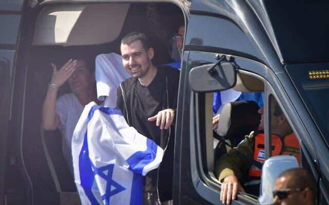 Released hostage Guy Gilboa-Dalal waves the Israeli flag as he arrives to Beilinson hospital, Oct. 13, 2025.(Photo by Avshalom Sassoni/Flash90, via JNS) Released hostage Guy Gilboa-Dalal waves the Israeli flag as he arrives to Beilinson hospital, Oct. 13, 2025.(Photo by Avshalom Sassoni/Flash90, via JNS)
