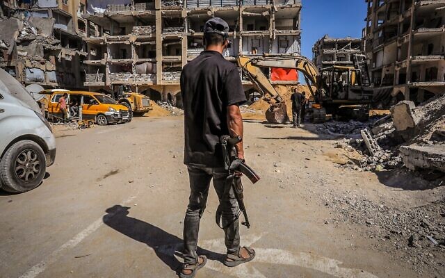 Hamas uses bulldozers to search for the bodies of Israeli hostages who were held in Khan Yunis, the southern Gaza Strip, Oct. 18, 2025. (Photo by Saeed Mohammed/Flash90) Hamas uses bulldozers to search for the bodies of Israeli hostages who were held in Khan Yunis, the southern Gaza Strip, Oct. 18, 2025. (Photo by Saeed Mohammed/Flash90)