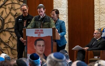 Ronen and Orna Neutra, with their son Daniel, speak at the Midway Jewish Center on Long Island during a memorial service for their son, Omer Neutra, an Israeli American soldier killed on Oct. 7, in Syosset, New York, Dec. 3, 2024. (Spencer Platt/Getty Images)