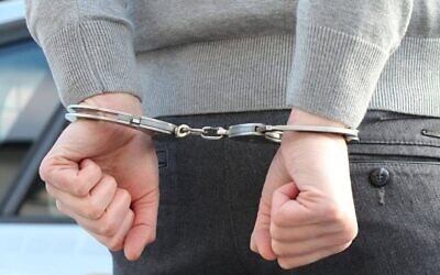 Person in handcuffs. (Credit: Pixabay)