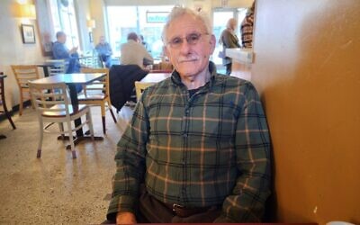 Eddie Shaw sits in a Squirrel Hill coffee shop. (Photo by Adam Reinherz)