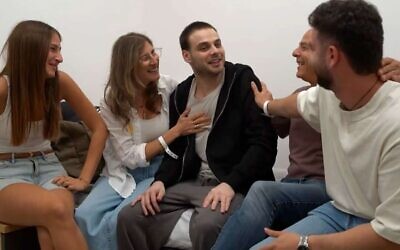 Alon Ohel with his family at the initial absorption point, Oct. 13, 2025. (Credit: IDF Spokesperson's Office)