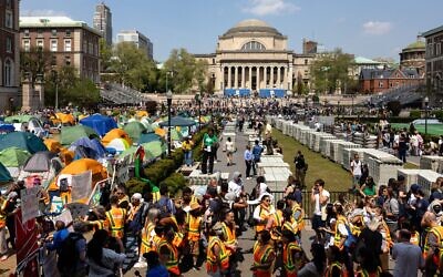 Columbia University faculty members protect students in the Pro-Palestinian "Gaza Solidarity Encampment" on April 29, 2024 in New York City. (Michael M. Santiago/Getty Images)