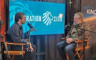 Liberated hostage Omer Shem Tov speaks with Luke Moon, of Generation Zion, at Turning Point USA's America Fest event in Phoenix, Dec. 19, 2025. (Photo by Audrey Hoffman)