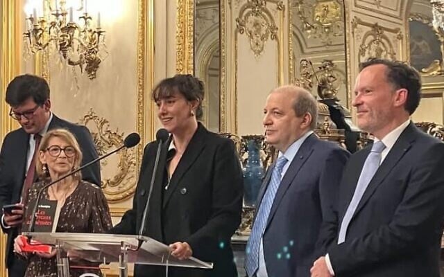Nora Bussigny at the podium of the French Senate as she receives the 2025 Prix Edgar Faure for best political book of the year. (Photo courtesy of Nora Bussigny) Nora Bussigny at the podium of the French Senate as she receives the 2025 Prix Edgar Faure for best political book of the year. (Photo courtesy of Nora Bussigny)