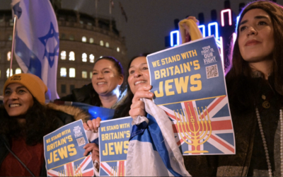 British Jews pose in front of a large menorah as they gather for a Hanukkah event in Trafalgar Square in central London, Dec. 16, 2025. (Richard A. Brooks / AFP via Getty Images)