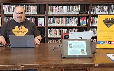Steve Jaron, president of the Jewish Genealogy Society of Pittsburgh, prepares for a program. (Photo courtesy of he Jewish Genealogy Society of Pittsburgh)