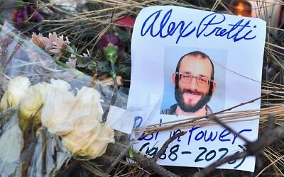 Flowers are left at a makeshift memorial in the area where Alex Pretti was shot dead a day earlier by federal immigration agents in Minneapolis, Minnesota, on Jan. 25, 2026. (Octavio JONES / AFP)
