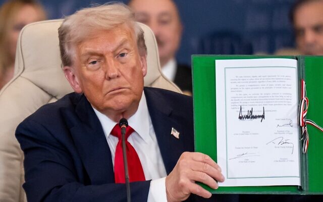President Donald Trump shows the signed peace treaty at the Gaza summit chaired by Egypt's President Al-Sisi on Oct. 14, 2025. (Michael Kappeler/picture alliance via Getty Images) President Donald Trump shows the signed peace treaty at the Gaza summit chaired by Egypt's President Al-Sisi on Oct. 14, 2025. (Michael Kappeler/picture alliance via Getty Images)